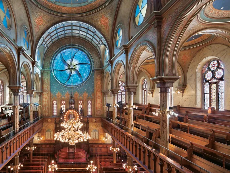 The stained-glass rose window of the restored Eldridge Street Synagogue, a history museum in New York