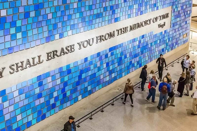 Visitors at the 9/11 Memorial reflecting pools above one of the most moving museums in New York's Financial District