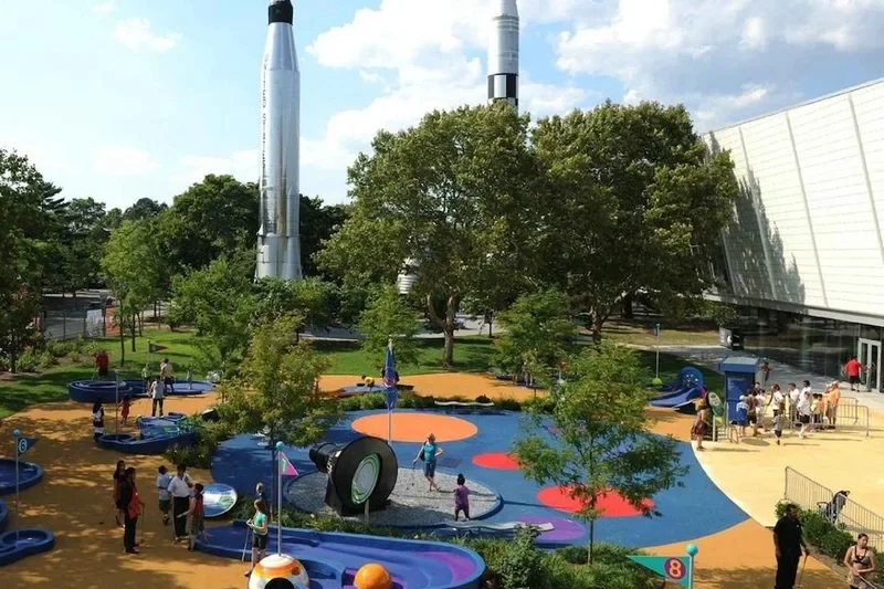 Kids exploring hands-on exhibits at a science museum in New York, one of the family stops outside Manhattan